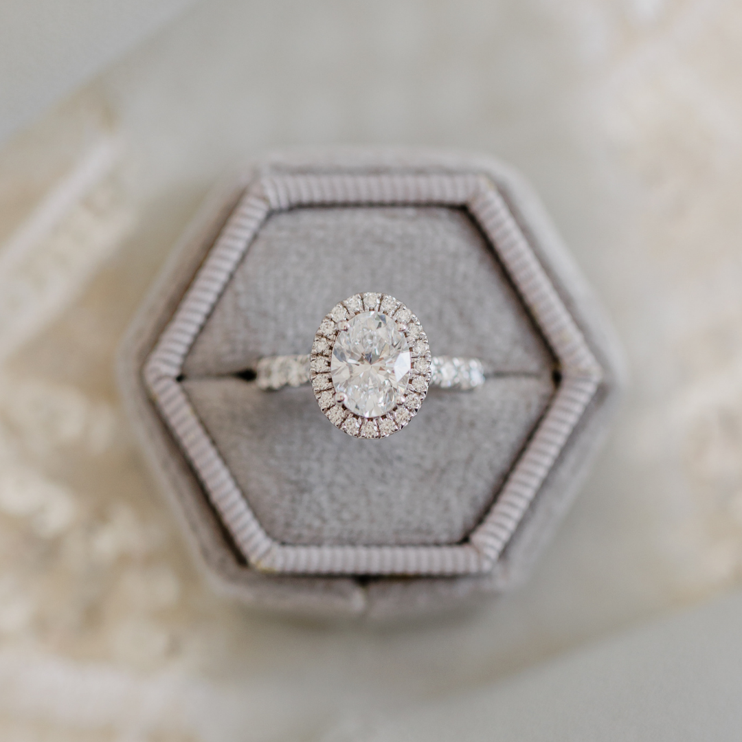 custom oval diamond engagement ring with diamond halo