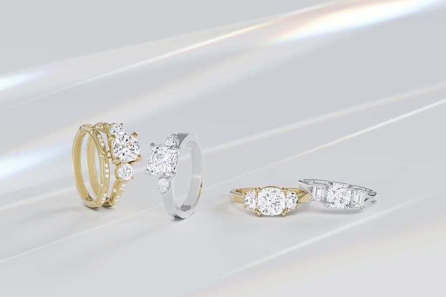 Various_Yellow_Gold_and_White_Gold_Diamond_Engagement_Rings_with_Dot_and_Claw_Prongs