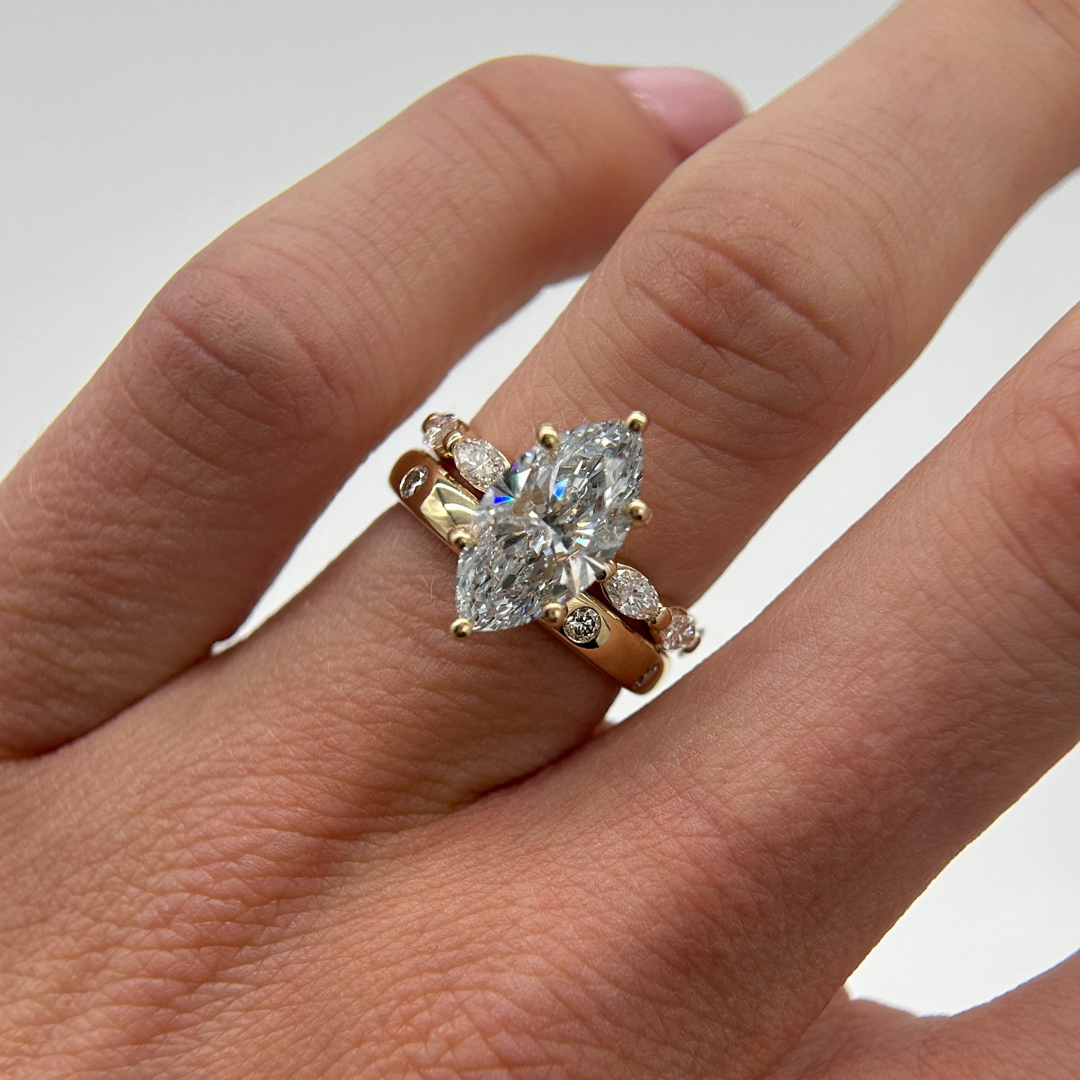 custom marquise engagement ring with matching wedding band