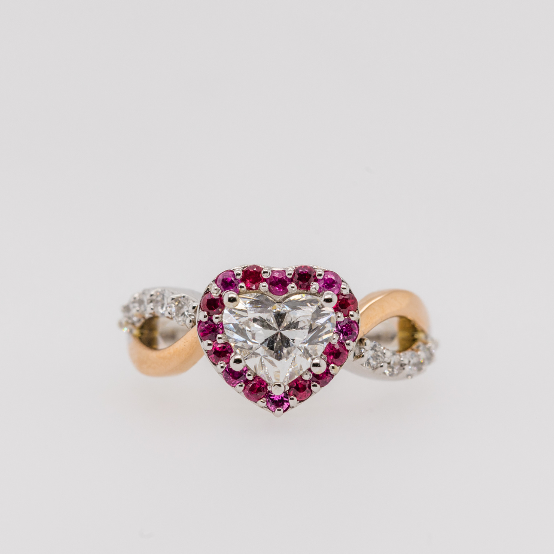 heart shaped diamond engagement ring with ruby halo