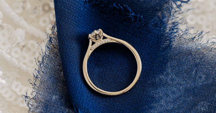 Bridge of an Engagement Ring with Accented Diamonds and Petal Prongs