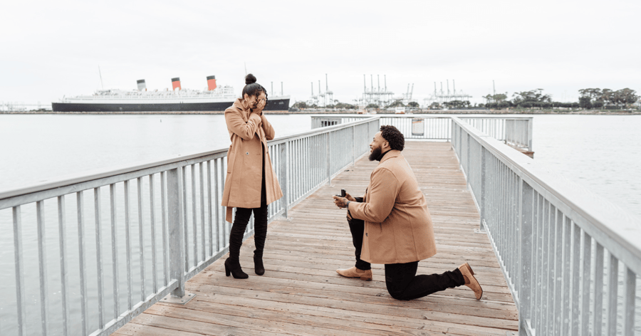 Couple Showing Joy and Excitement During Proposal on a Dock