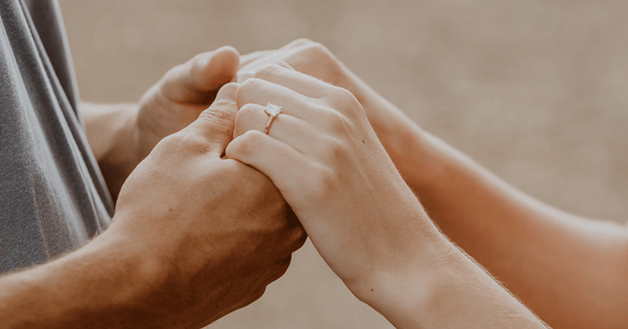 Couple_Holding _Hands _showing _engagement _ring