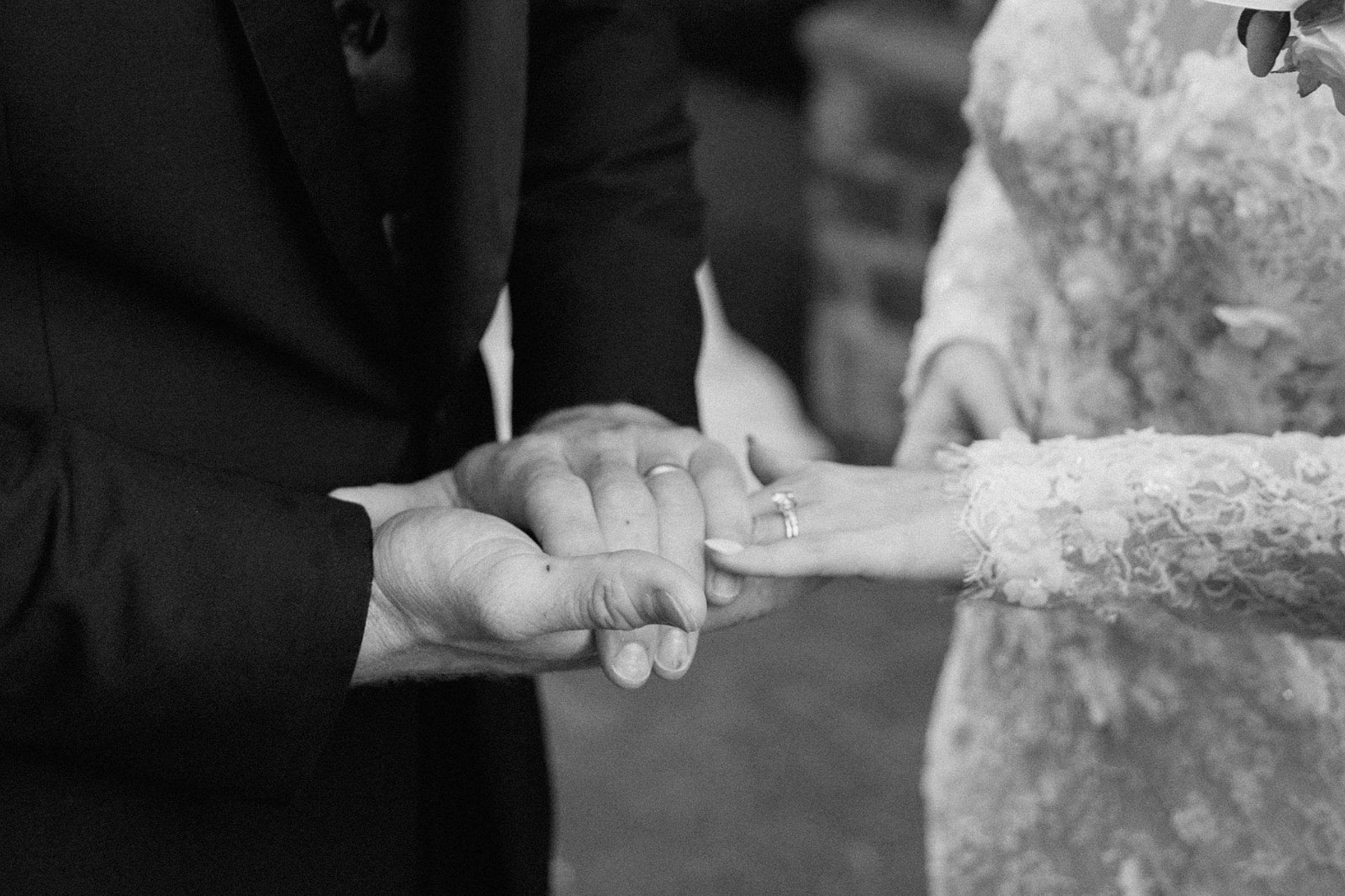 Couple_Showing_Wedding_Bands_on_Wedding_Day