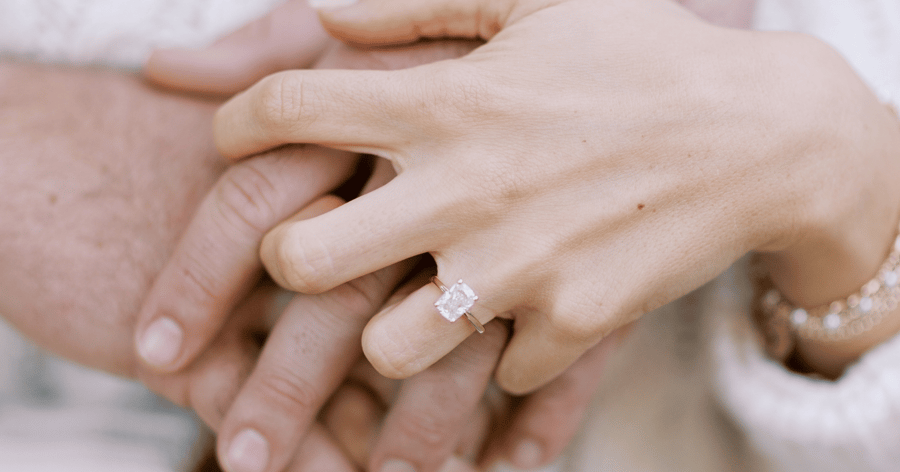 Elongated_cushion_engagement_ring_on_hand