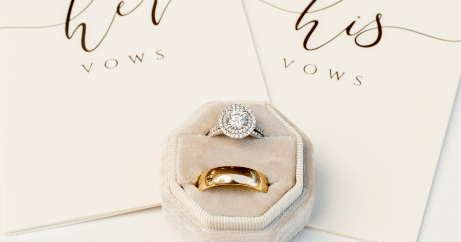 Engagement_ring_and_wedding_bands_in_velvet_box_on_wedding_day_shown_with_his_and_her_vows