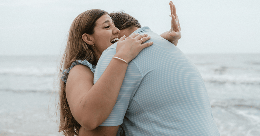 Newly Happy Engaged Couple Admiring Engagement Ring