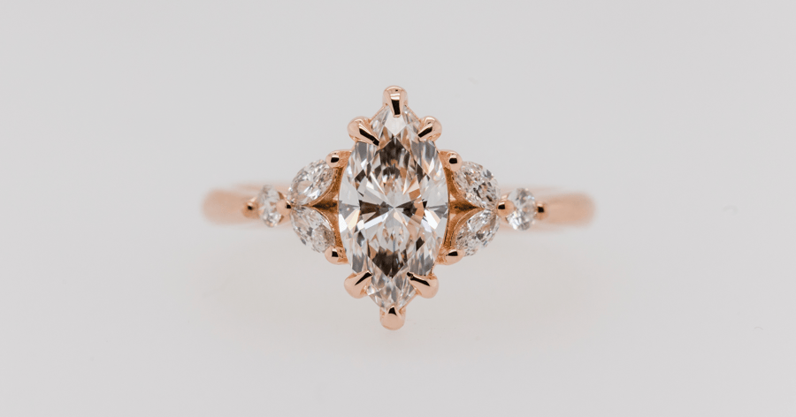 Rose Gold Accented Engagement Ring set with a Marquise Cut Diamond