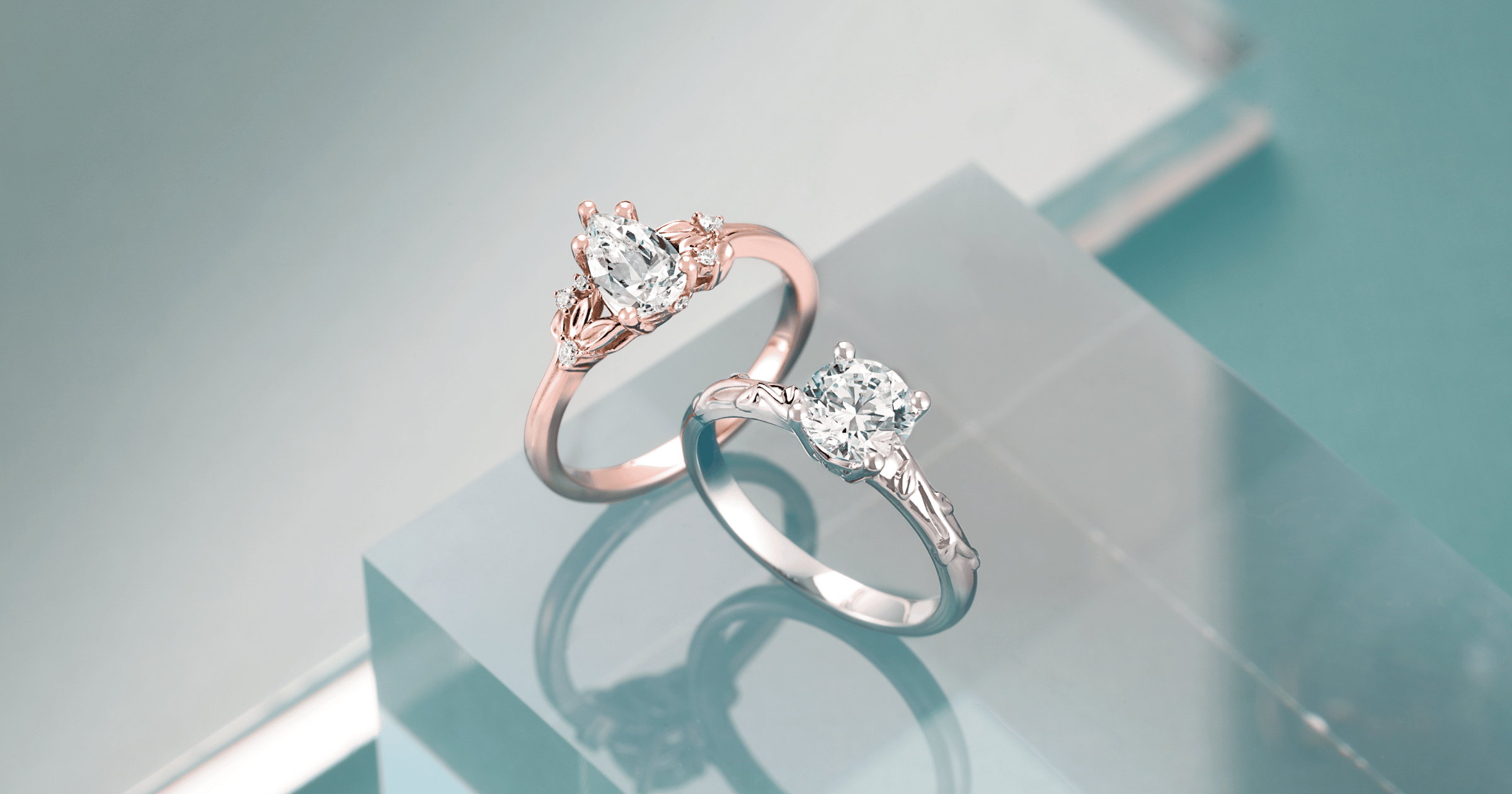 Rose Gold Accented Engagement Ring set with a Pear Cut Diamond; White Gold (or Platinum) Solitaire Engagement Ring set with a Round Cut Diamond