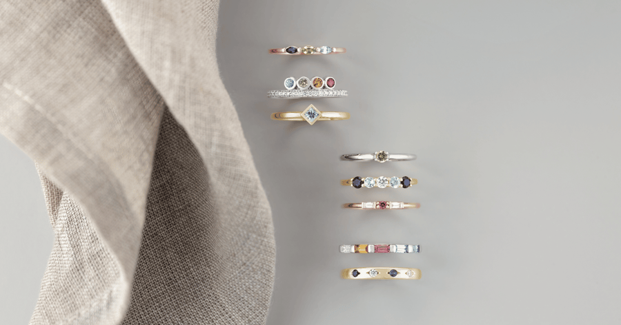 Rose_Gold_Yellow_Gold_and_White_Gold_(or_Platinum)_Rings_and_Bands_set with_various_Colored_and_Cut_Gemstones_and_Diamonds