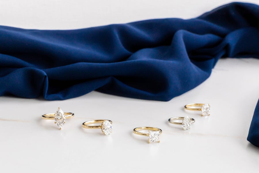 Solitaire_YellowGold_Engagement_Rings_Navy_Cloth