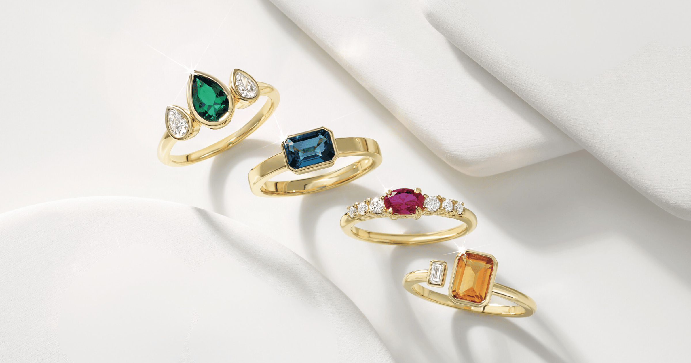 Various Yellow Gold Accented Engagement Rings set with Various Cut and Colored Gemstones and Styles