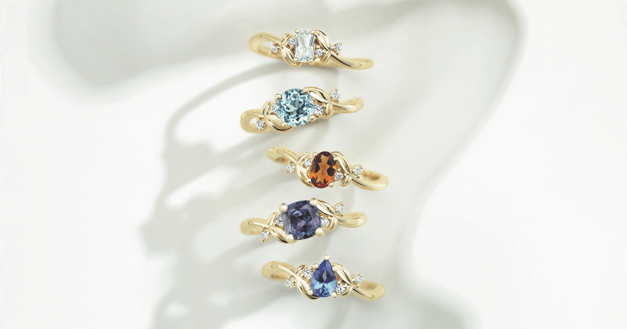 Various Yellow Gold Accented Engagement Rings set with Various Cut and Colored Gemstones