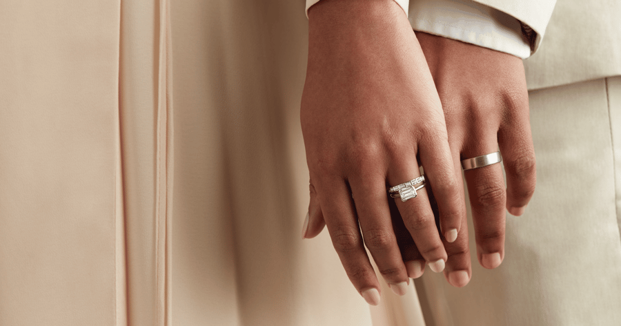 White Gold (or Platinum) Solitaire Engagement Ring set with an Emerald Cut Diamond; White Gold (or Platinum) Accented Wedding Band; White Gold (or Platinum) Mens Wedding Band