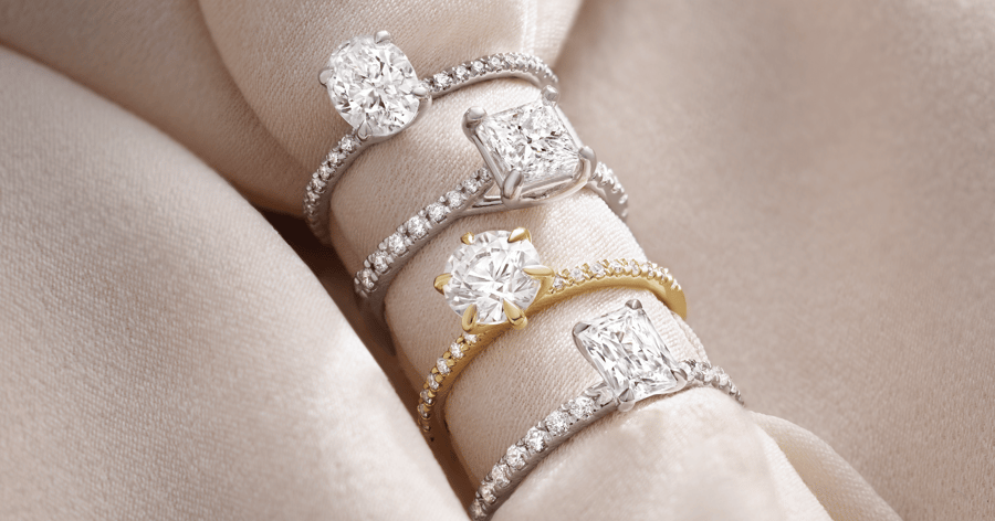 White Gold (or Platinum) and Yellow Gold Accented Engagement Rings set with Various Cut Diamonds