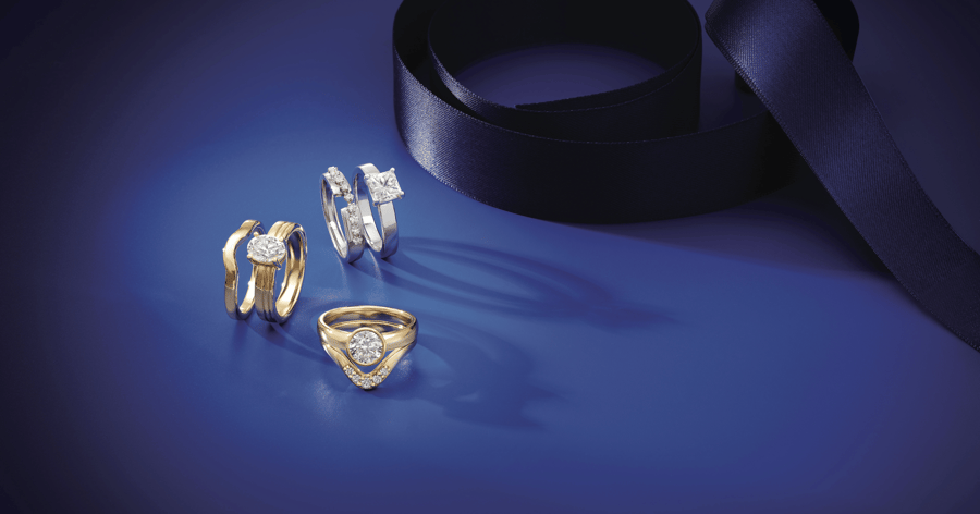 White_Gold_(or_Platinum)_and_Yellow_Gold_Solitaire_Engagement_Rings_shown_with_Complementary_Countoured_Wedding_Bands
