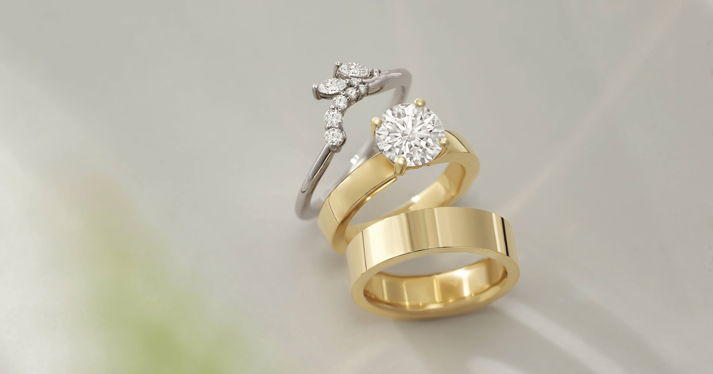 Yellow Gold Solitaire Engagement Ring set with a Round Cut Diamond; Matching Yellow Gold Wedding Band; White Gold (or Platinum) Accented Wedding Band