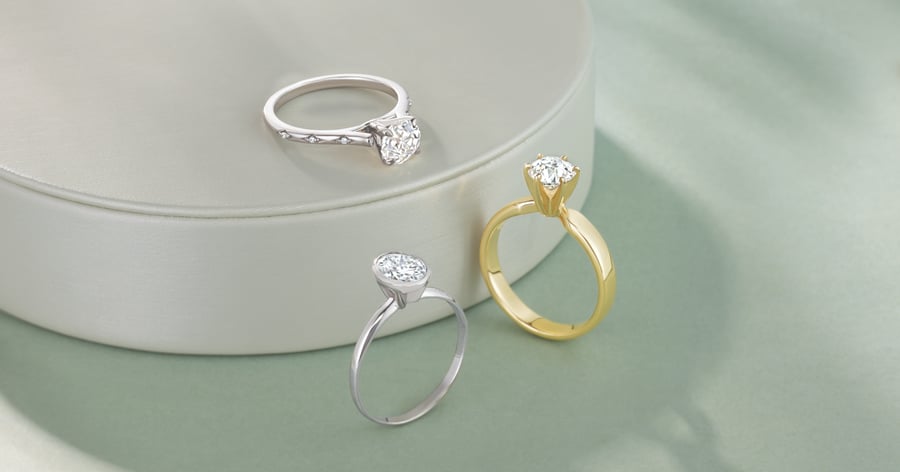 Yellow Gold and White Gold (or Platinum) Engagement Ring Styles set with Oval and Round Cut Diamonds