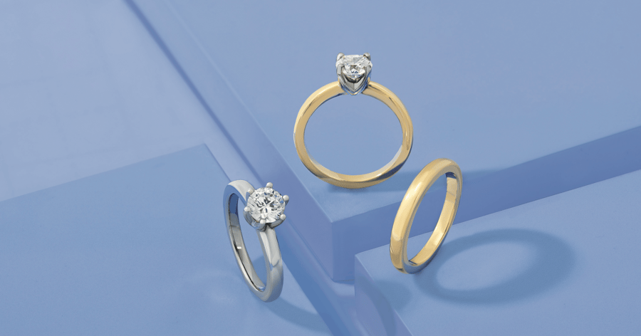 Yellow Gold with White Gold (or Platinum) Prongs Solitaire Engagement Ring set with a Round Cut Diamond and Matching Wedding Band; White Gold (or Platinum) Solitaire Engagement Ring set with a Round Cut Diamond