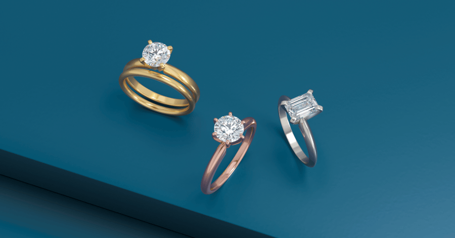 Yellow Gold, Rose Gold, and White Gold (or Platinum) Solitaire Engagement Rings set with Round and Emerald Cut Diamonds; Matching Yellow Gold Wedding Band