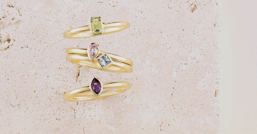 Yellow_Gold_Rings_set_with_Various_Colored_and_Shaped_Gemstones