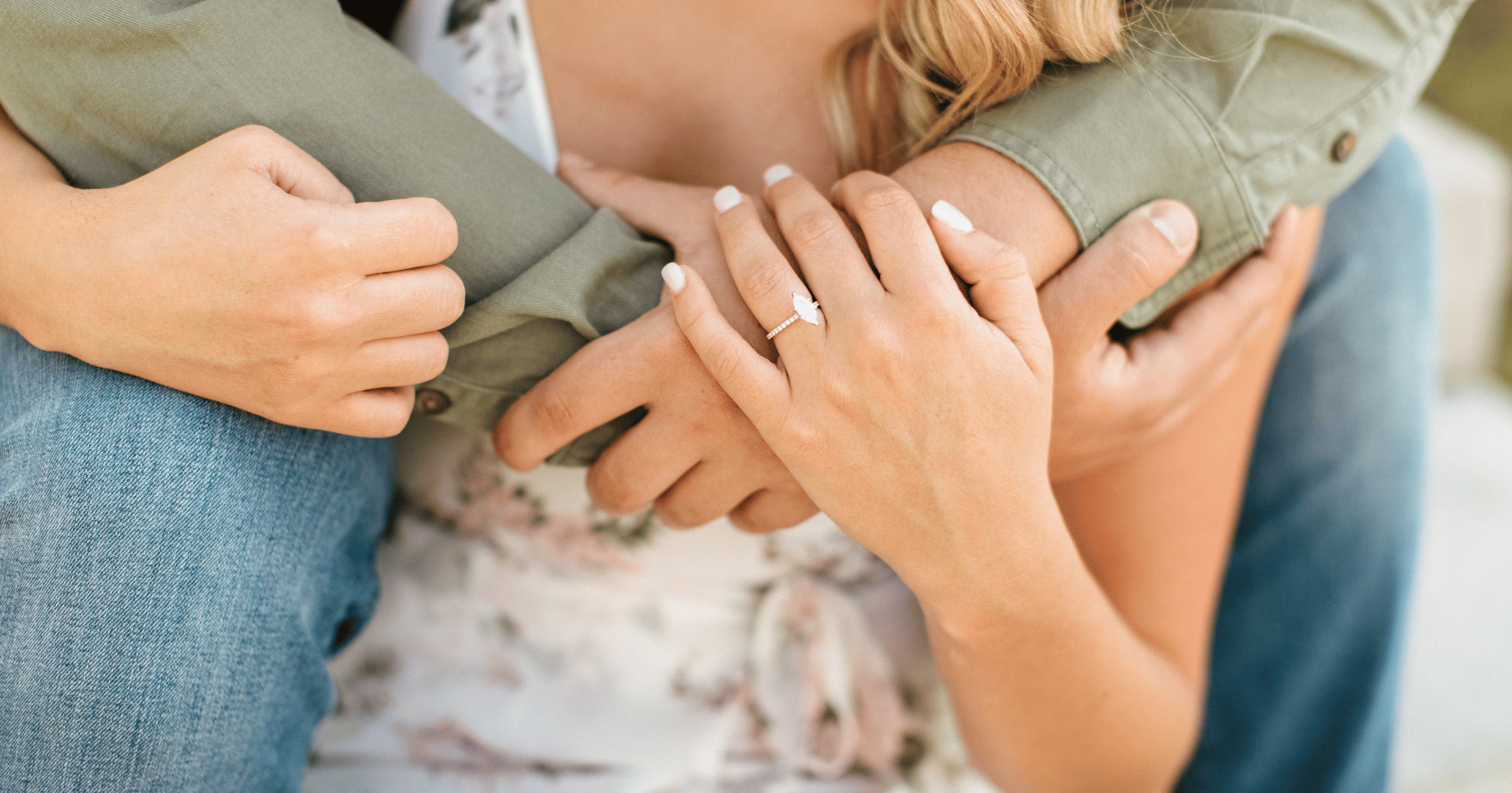 Rose Gold Accented Engagement Ring set with a Marquise Cut Diamond shown on Left Hand Ring Finger