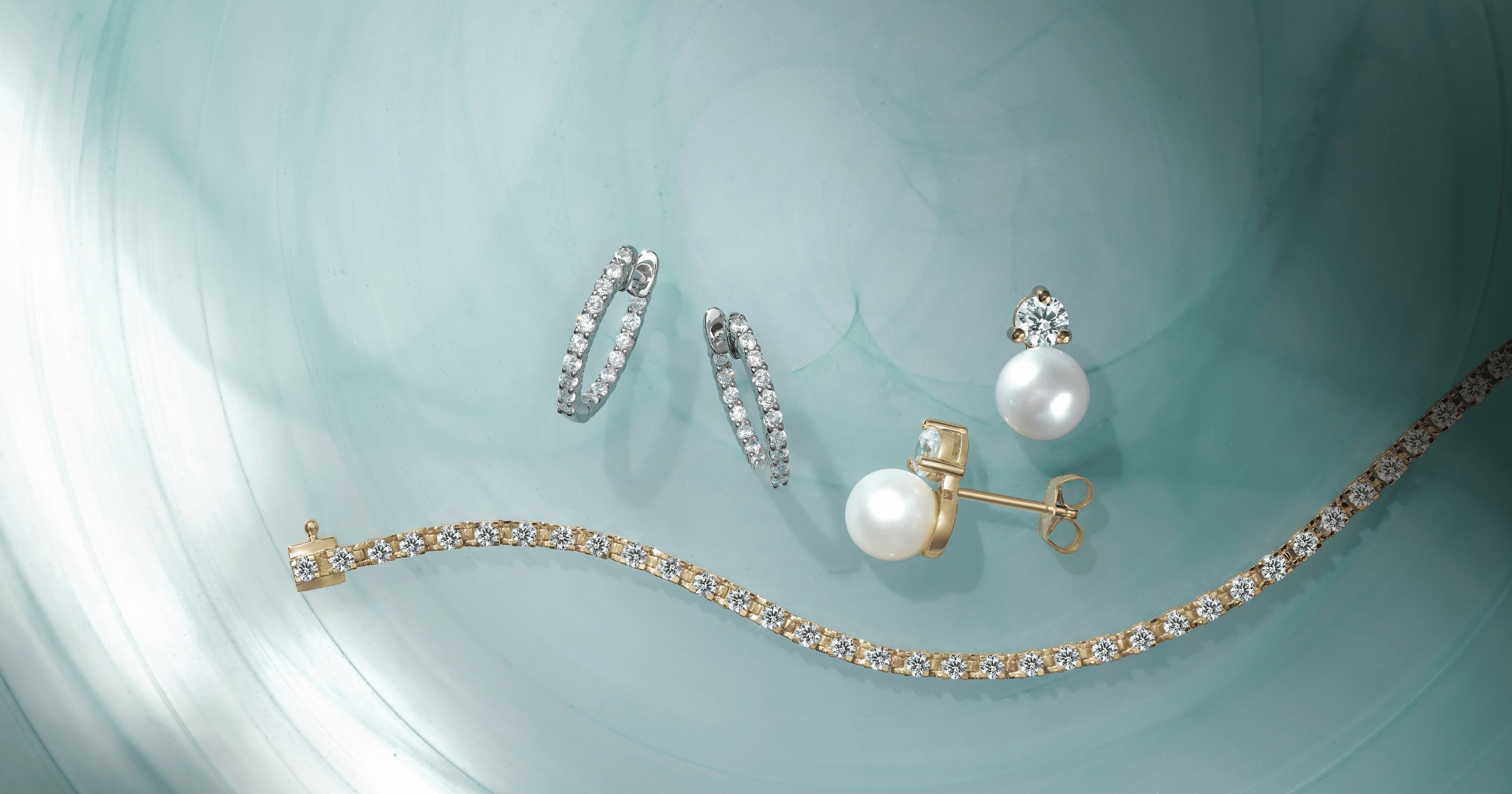 Various_diamond_and_pearl_earrings_and_tennis_bracelet