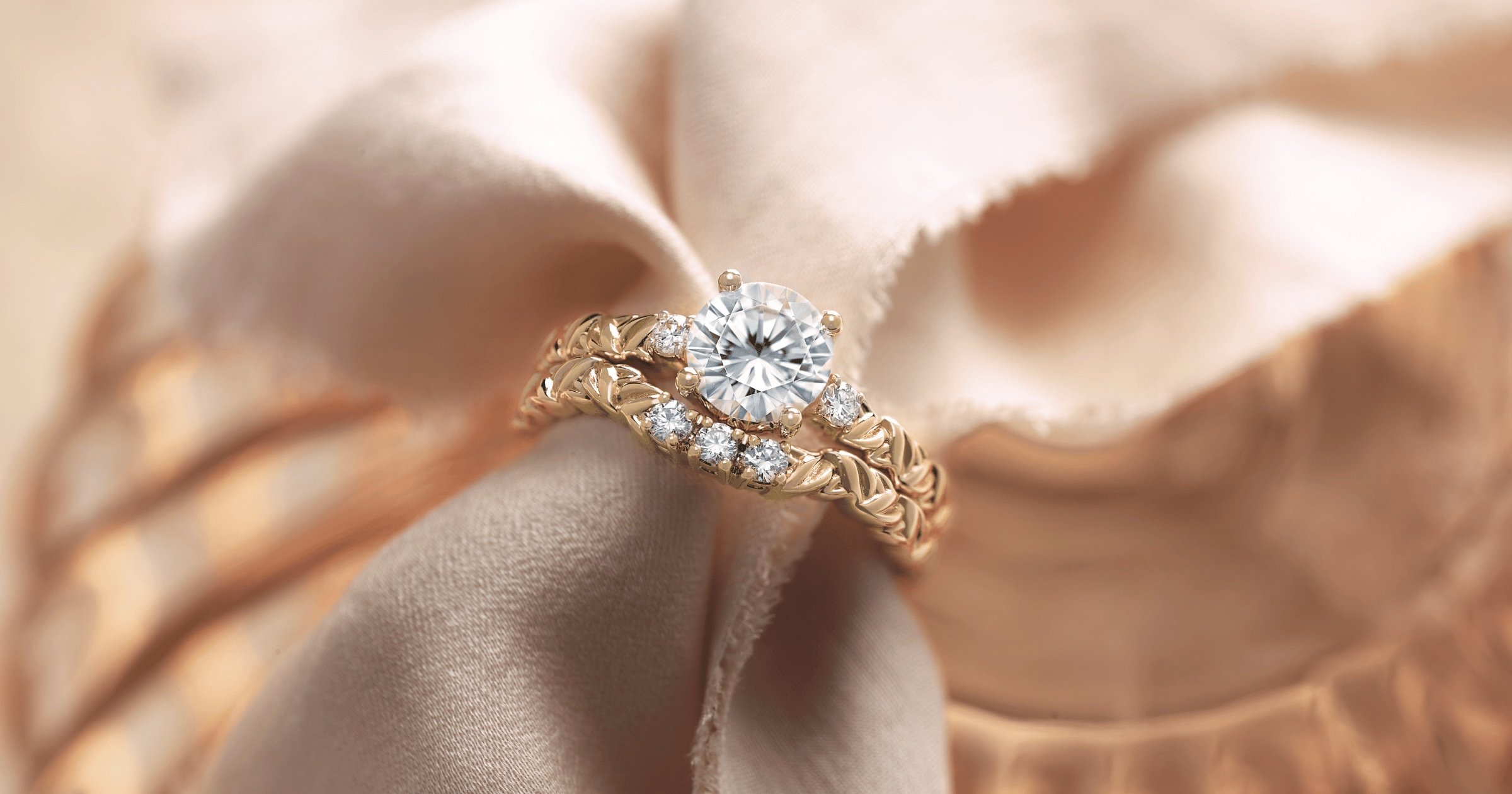 Rose Gold Round Diamondn Engagement Ring with Accenting Stones and Intricate Band and Complimenting Wedding Band